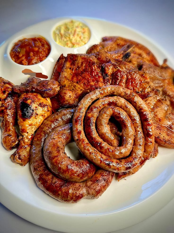 Braai meat platter with grilled chicken, boerewors and chops